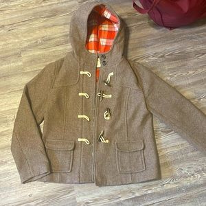 Pea coat. Brownish with plaid on inside!